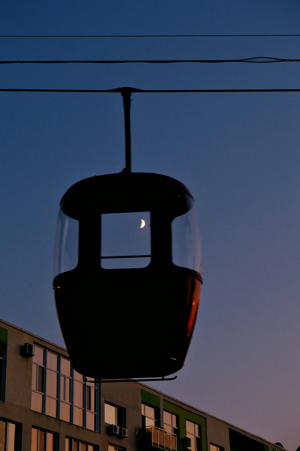 a gondola with a half moon in the sky