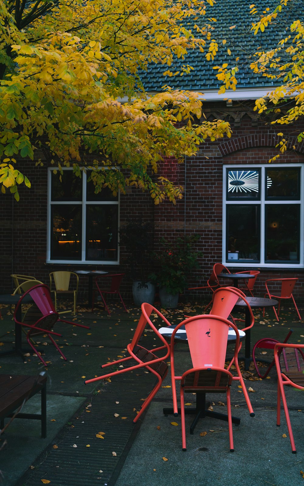 a group of red chairs sitting next to each other