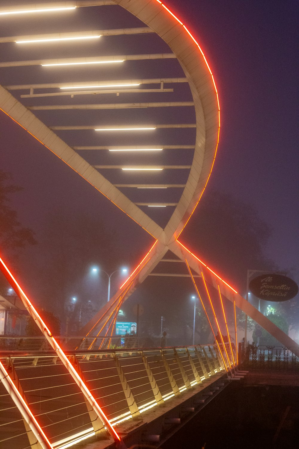 a large spiral shaped structure lit up at night