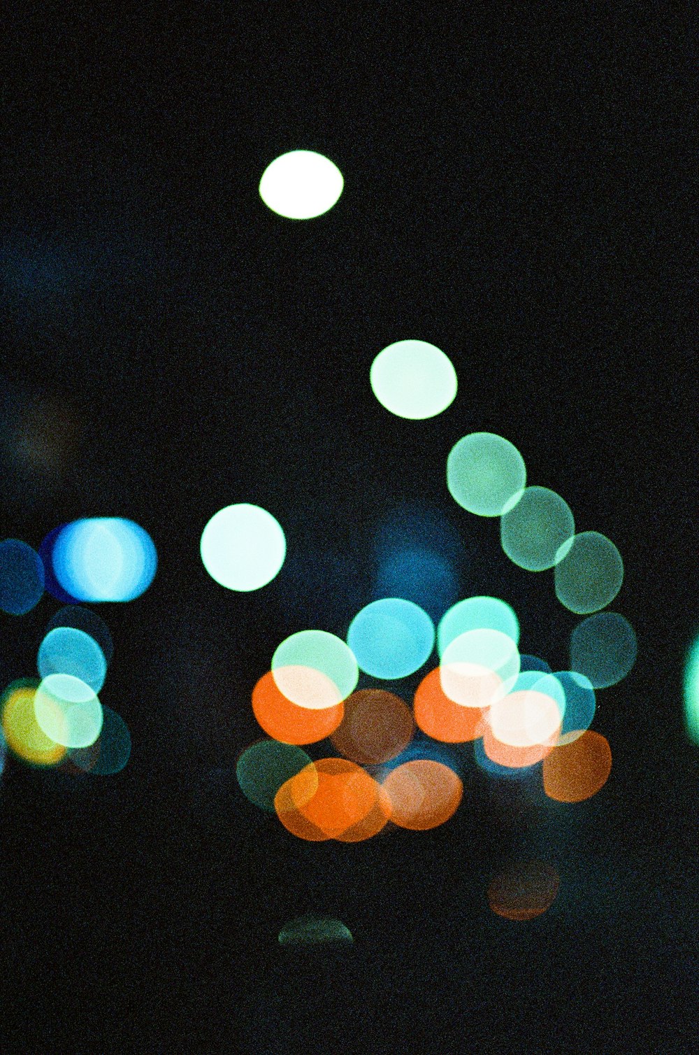 a blurry photo of a city street at night