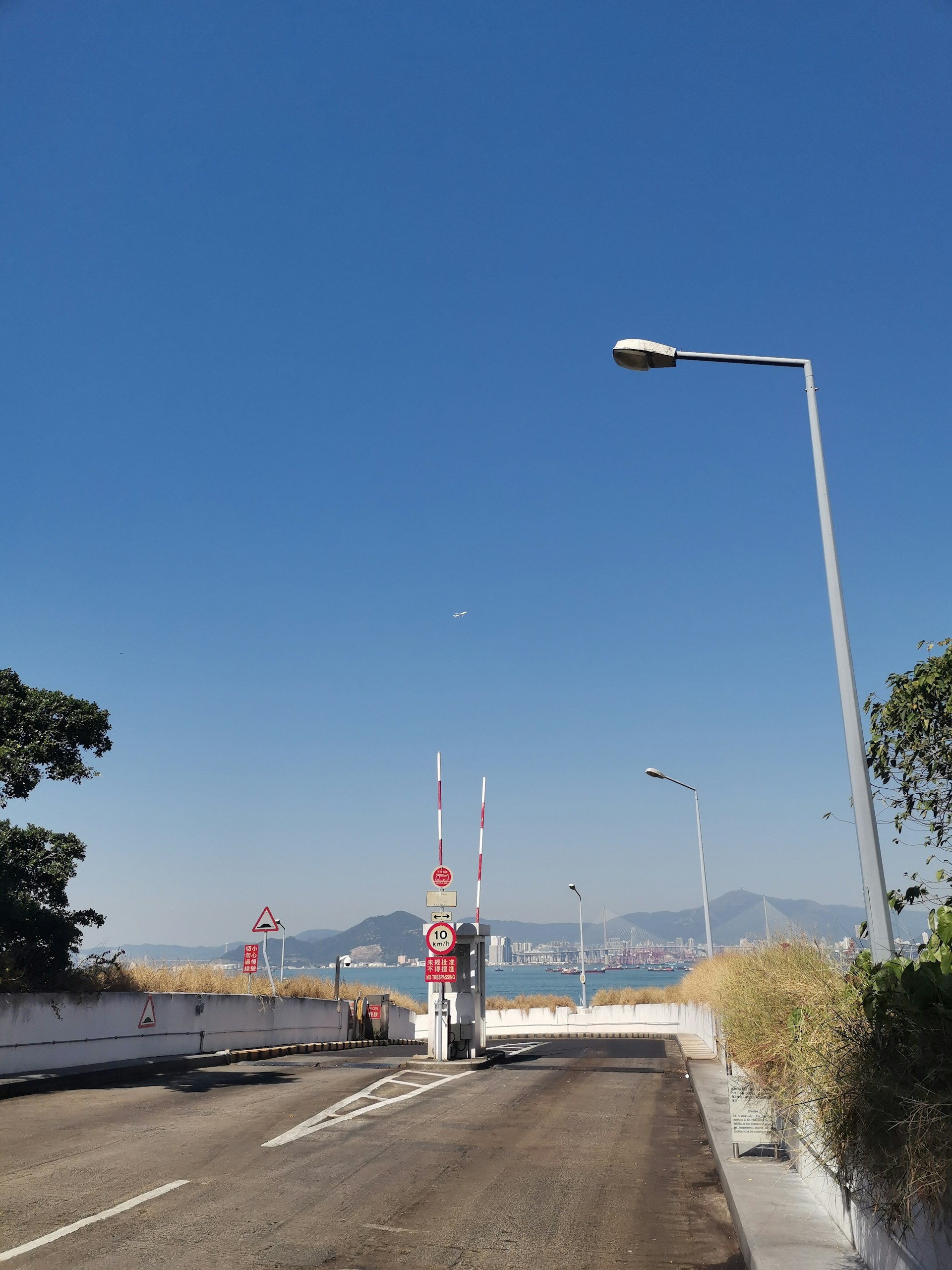 woman wearing yellow long-sleeved dress under white clouds and blue sky during daytime