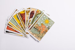 a deck of tarot cards on a white surface