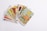 A collection of tarot cards spread out, with the card depicting 'The Star' prominently displayed on top. The cards feature intricate and colorful illustrations with various symbols and figures.