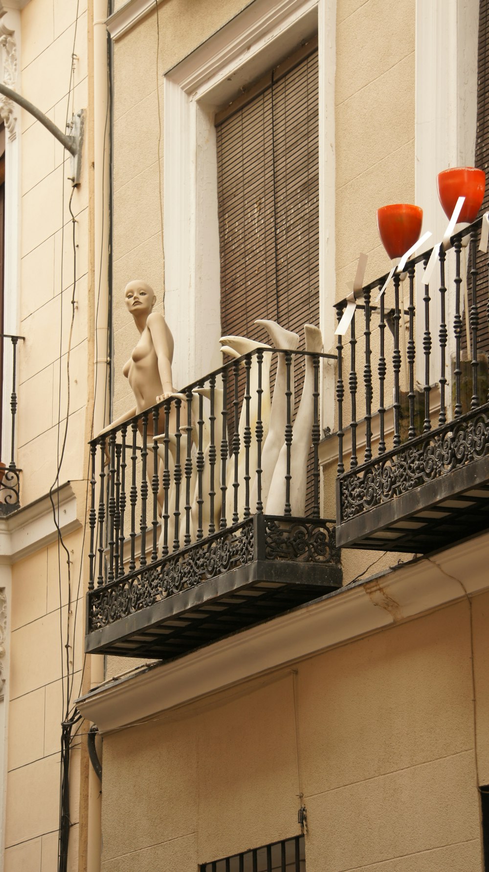 a balcony with vases on the balconies