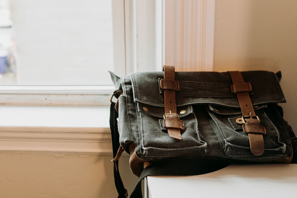 a bag sitting on top of a window sill