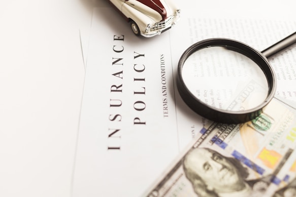 Reviewing Insurance documents with magnifier