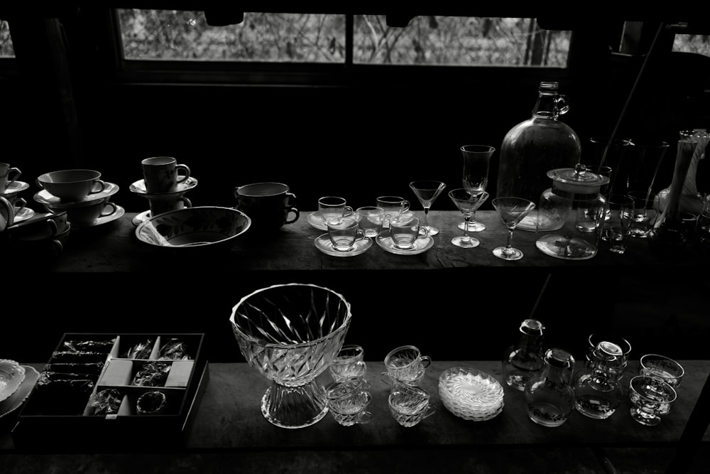 a table topped with lots of glass dishes