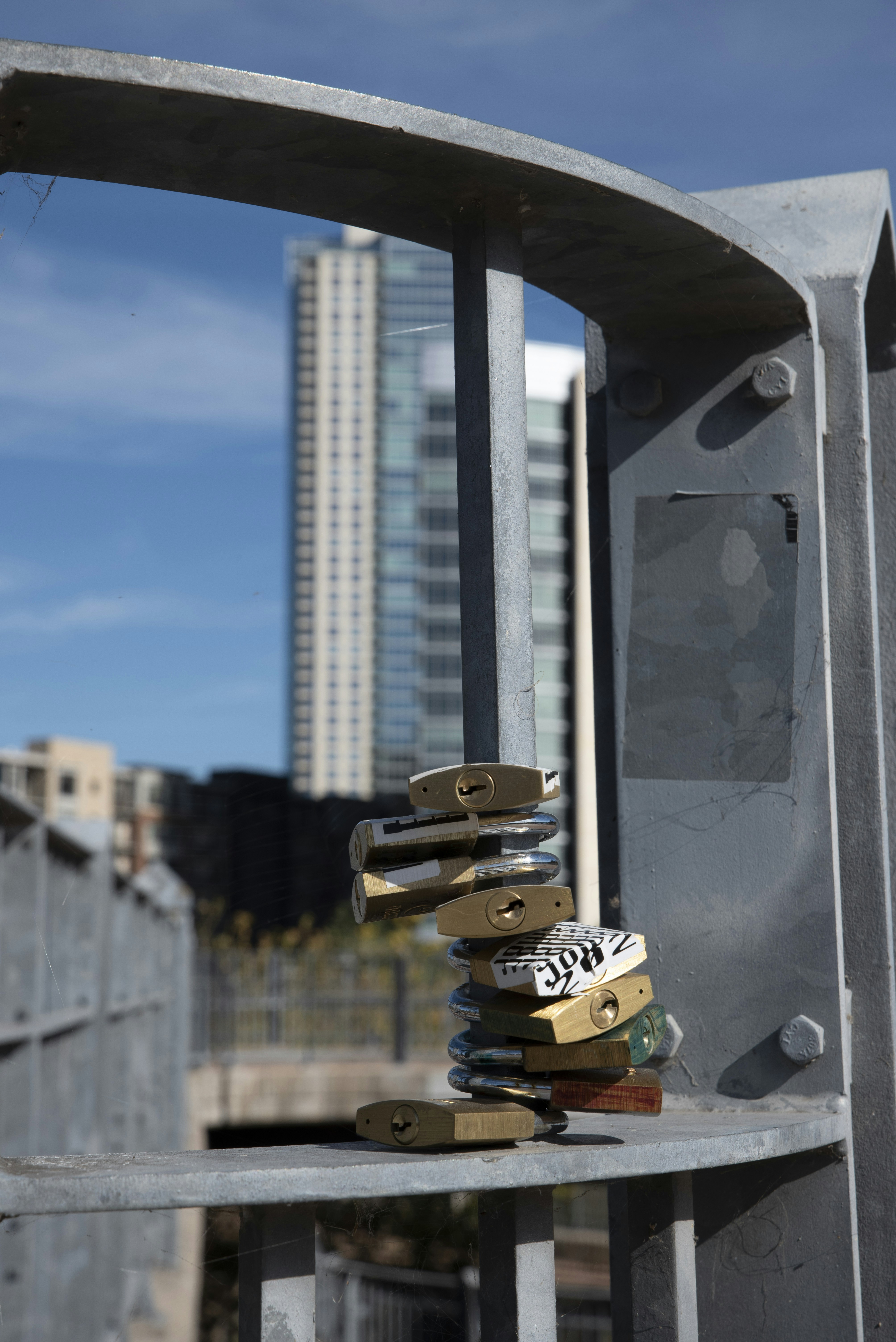 a stack of books sitting on top of a metal bench