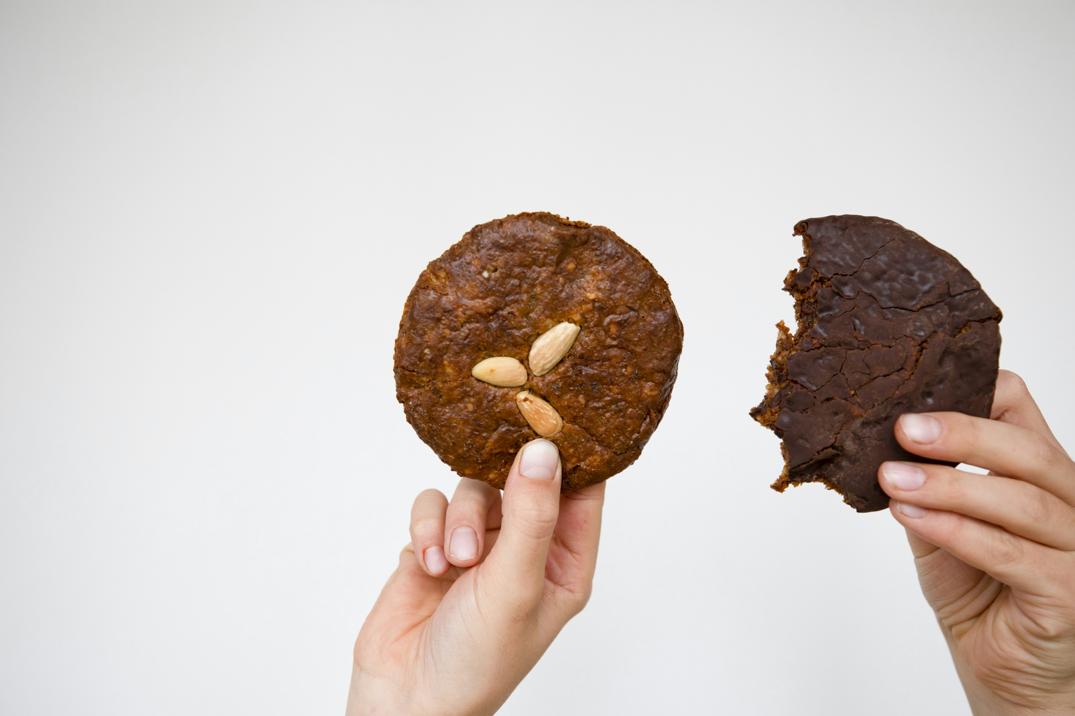 a person holding a piece of food in their hands