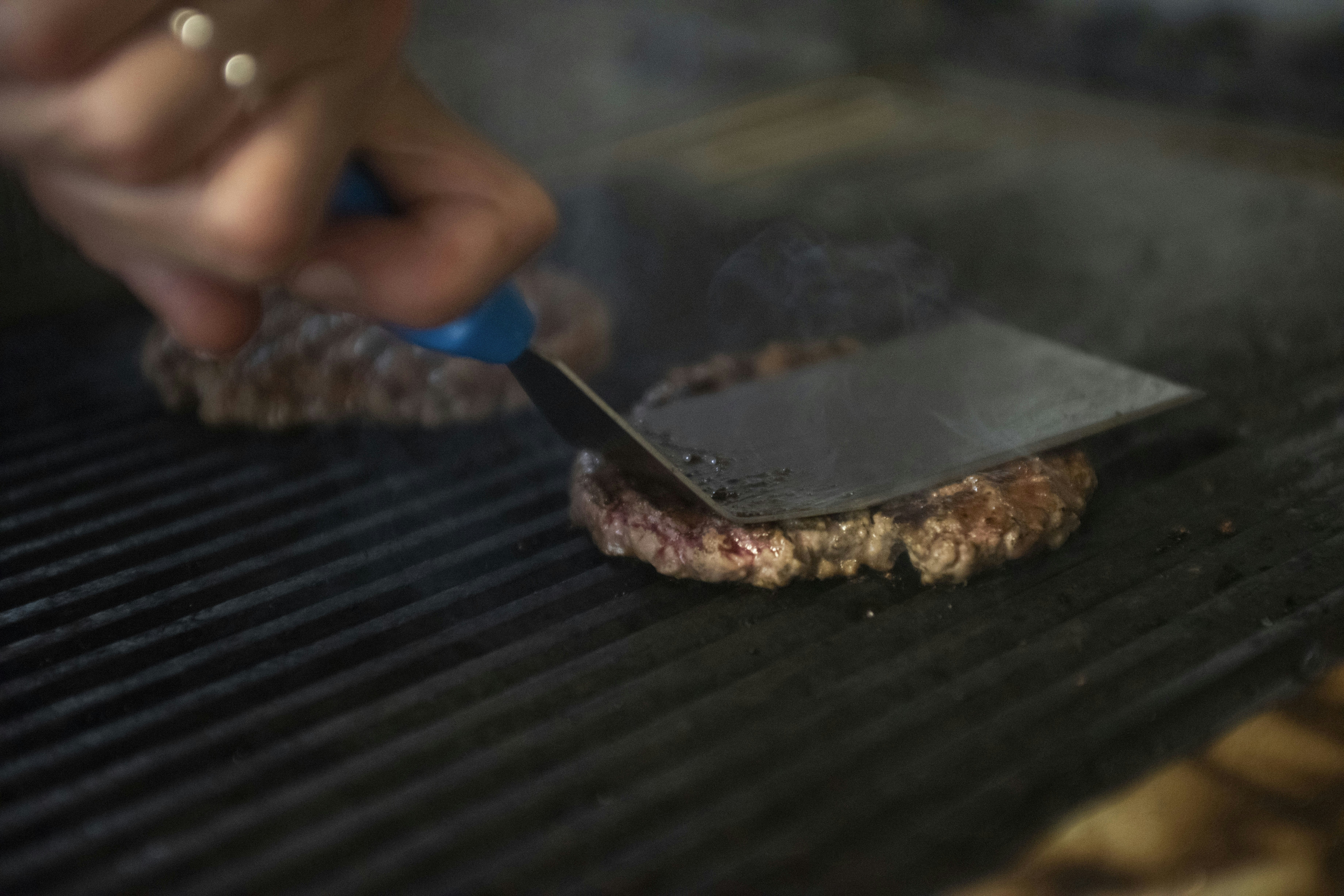 woman wearing yellow long-sleeved dress under white clouds and blue sky during daytime