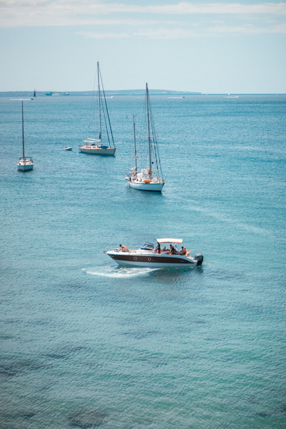 a number of small boats in a body of water