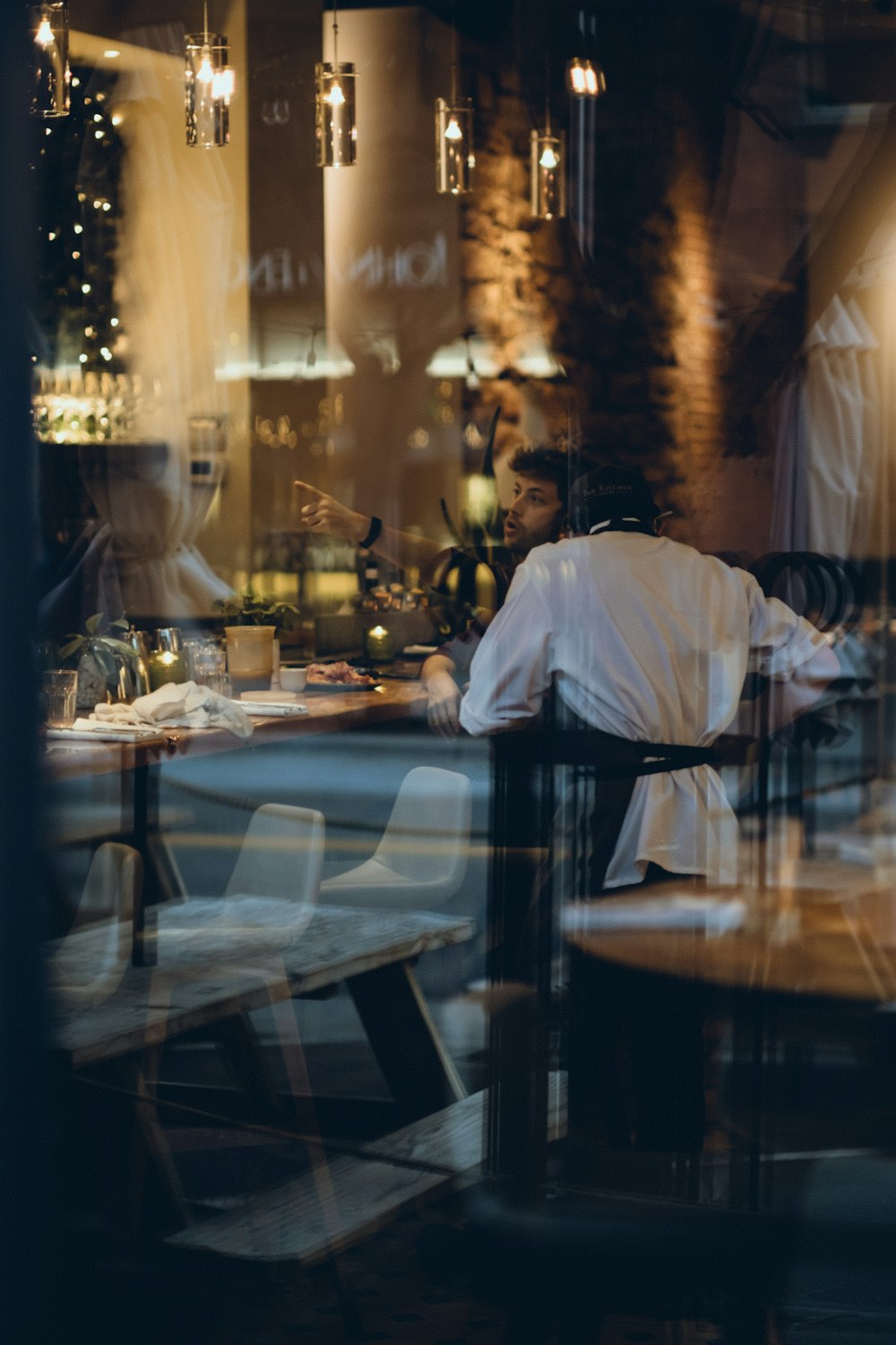 a man sitting at a table in a restaurant