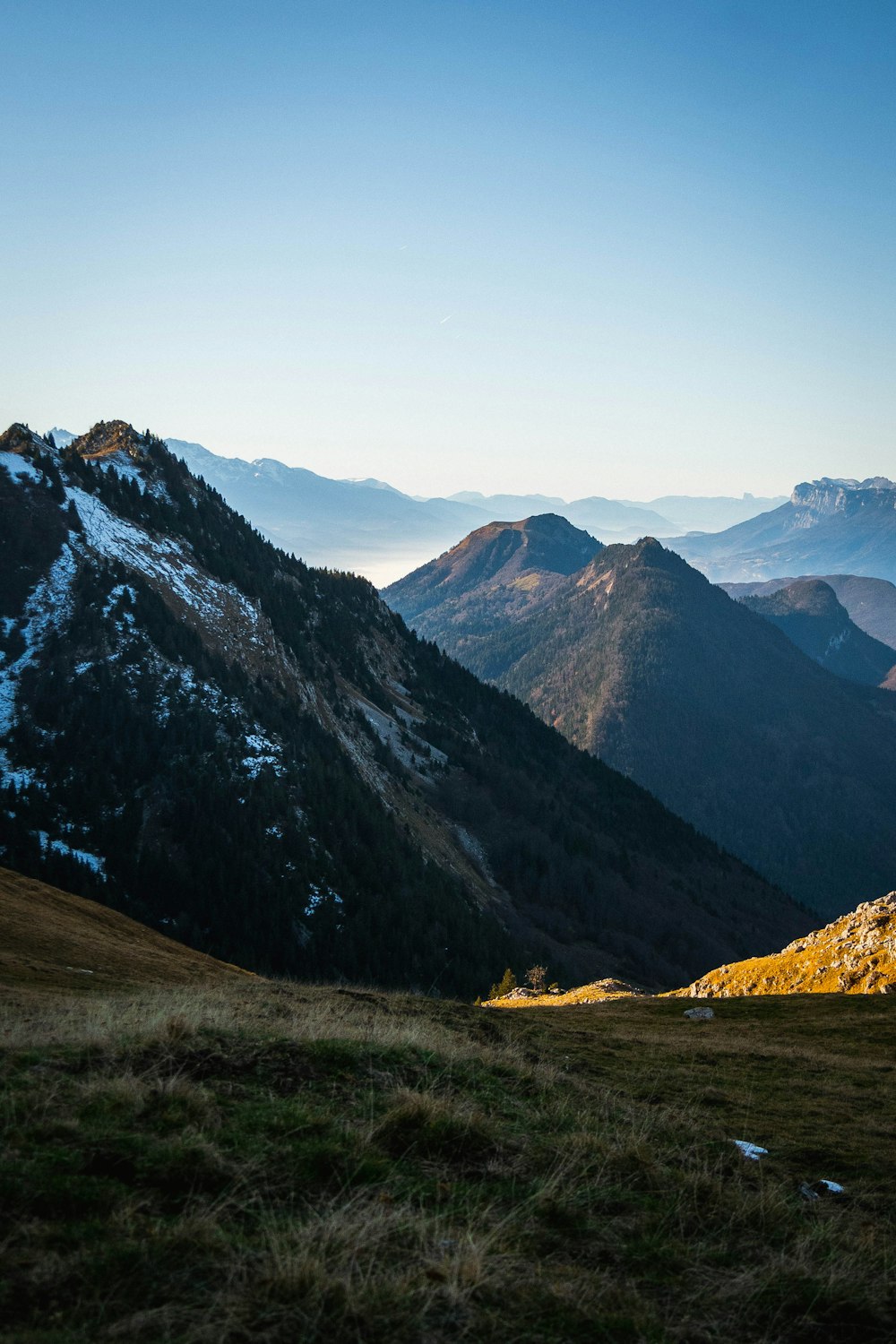 a view of a mountain range with snow on the mountains