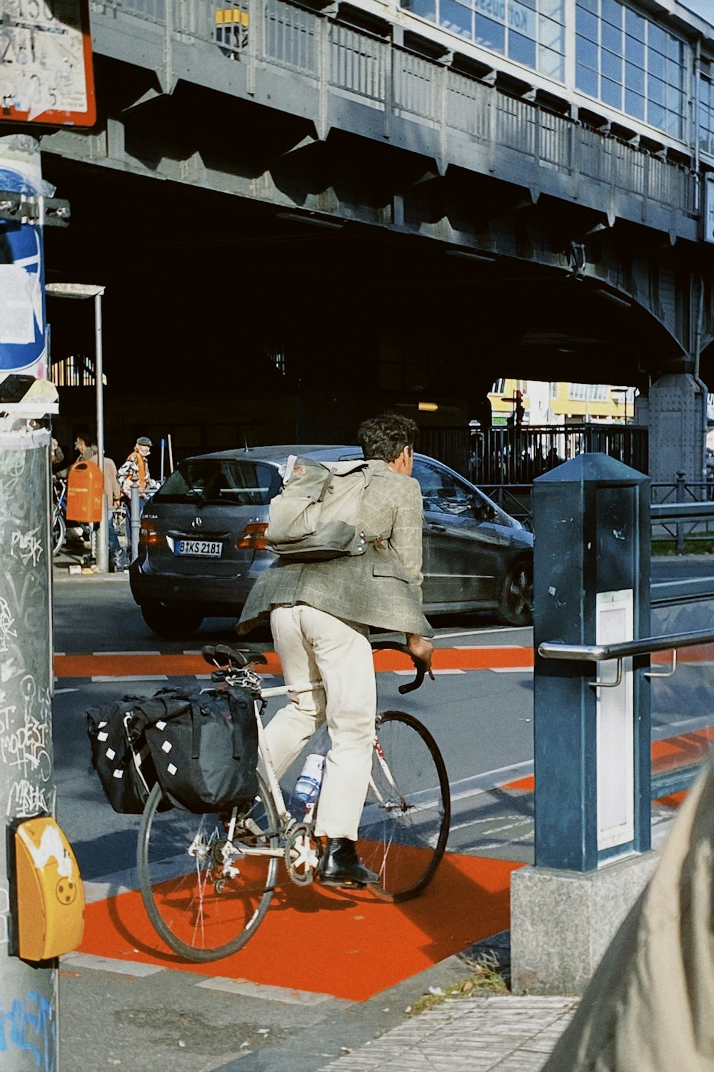 a man riding a bike down a street