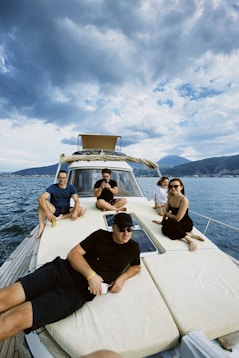 a group of people sitting on top of a boat