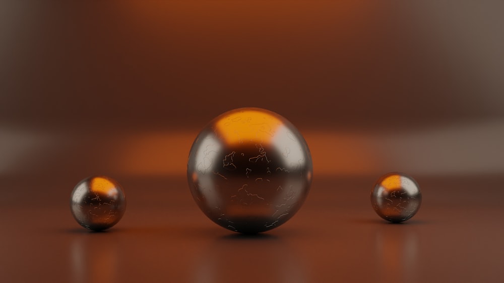 a group of shiny balls sitting on top of a table