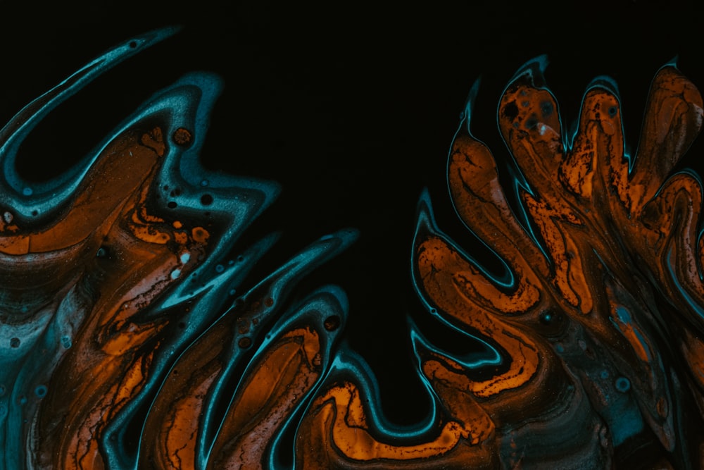 a black background with orange and blue swirls