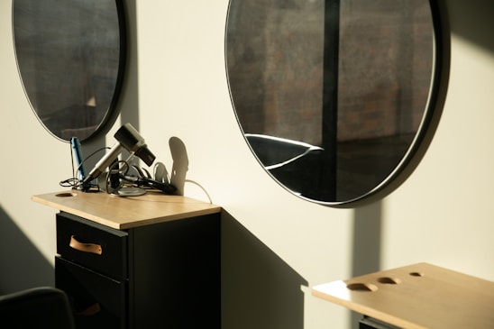 a room with two round mirrors on the wall