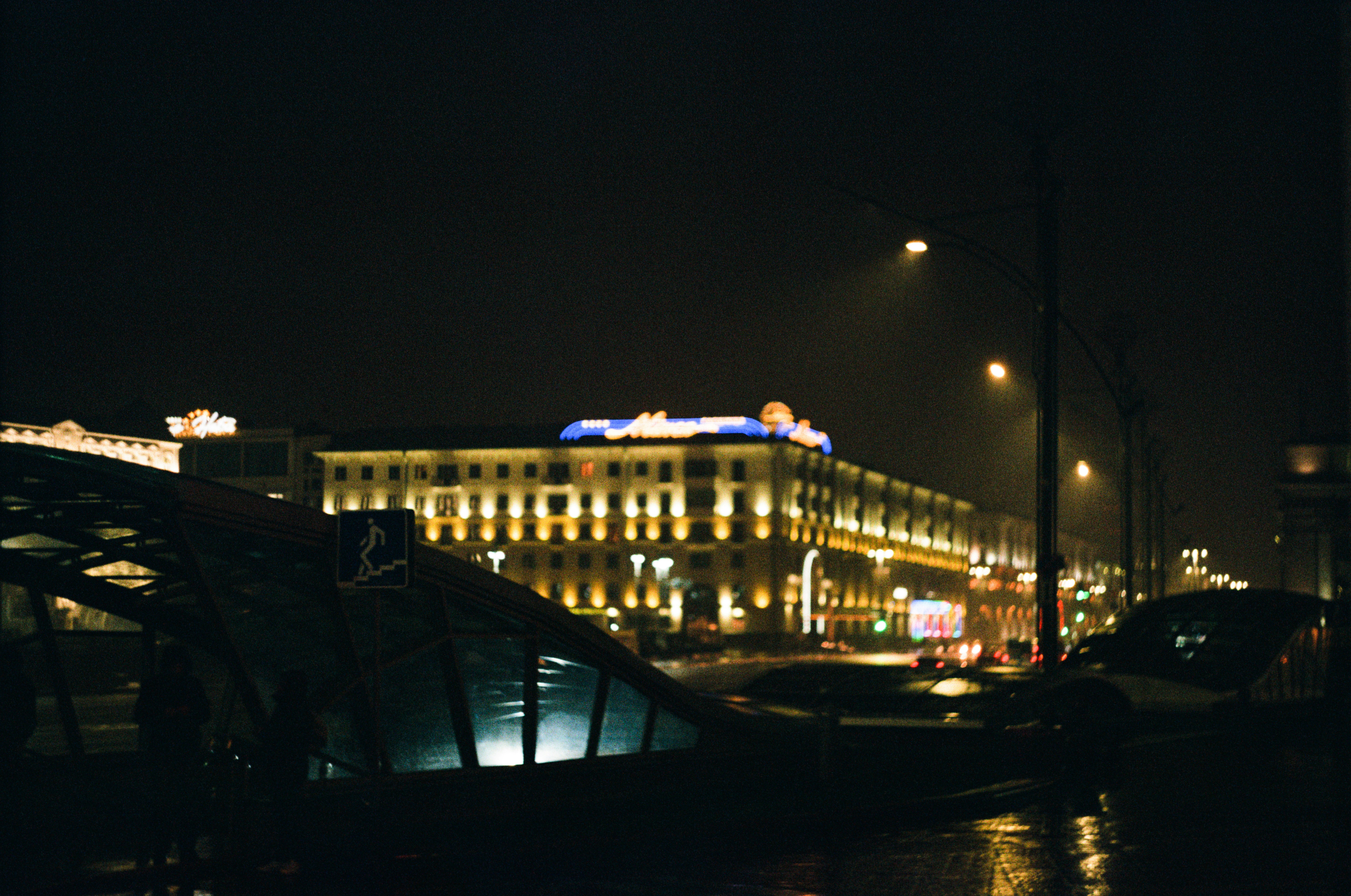 a night view of a building and a bridge