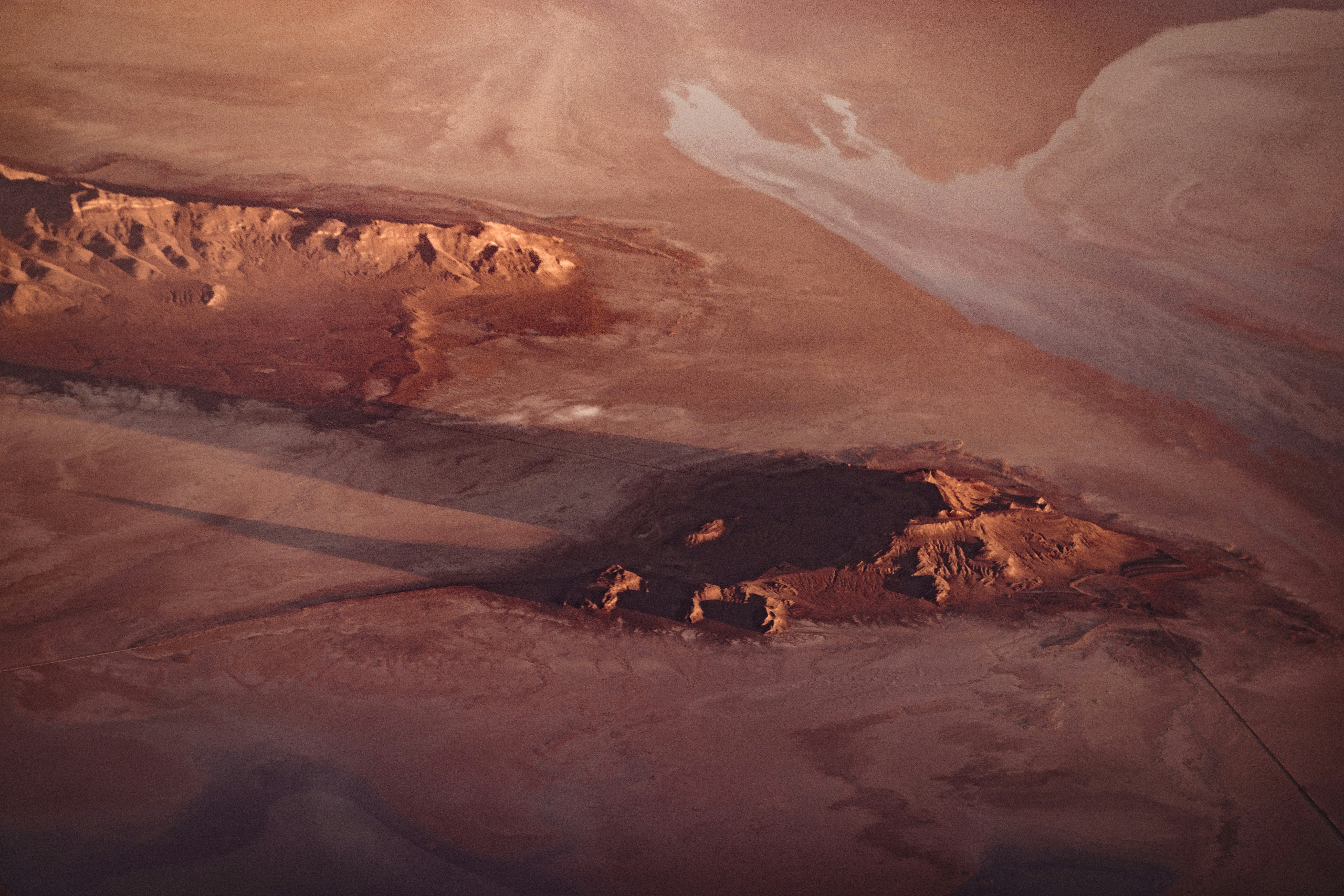 an aerial view of a mountain range in the desert