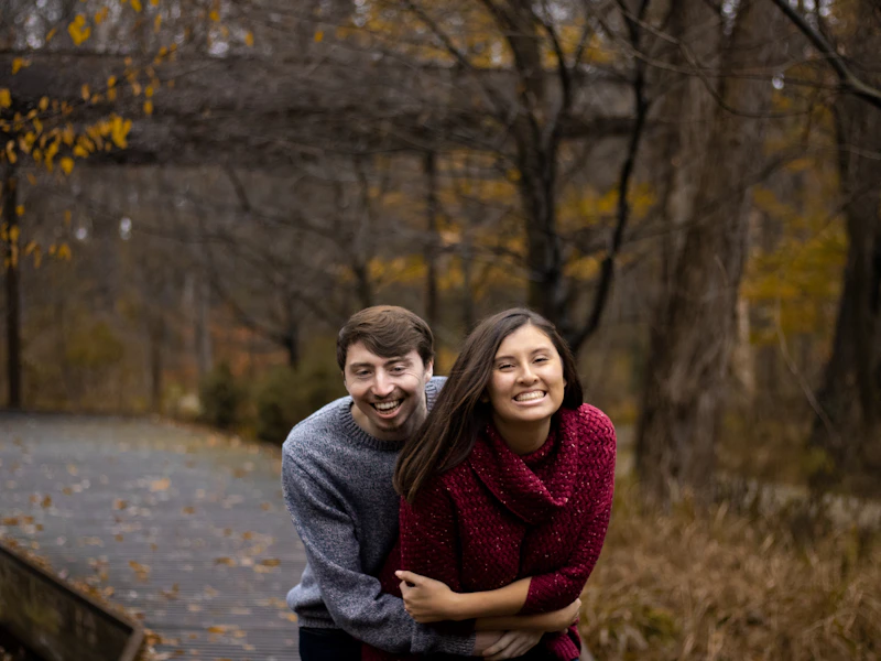 smiling man and woman standing together
