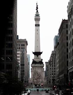 a tall white monument in the middle of a city