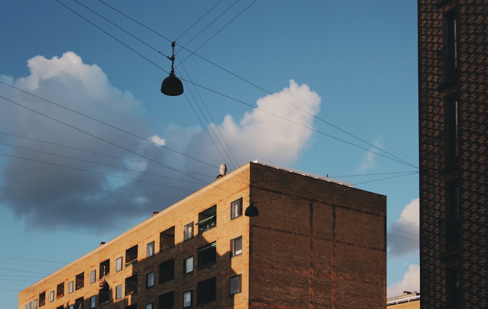 a tall brick building sitting next to a tall building