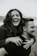 a man and a woman are laughing in a field