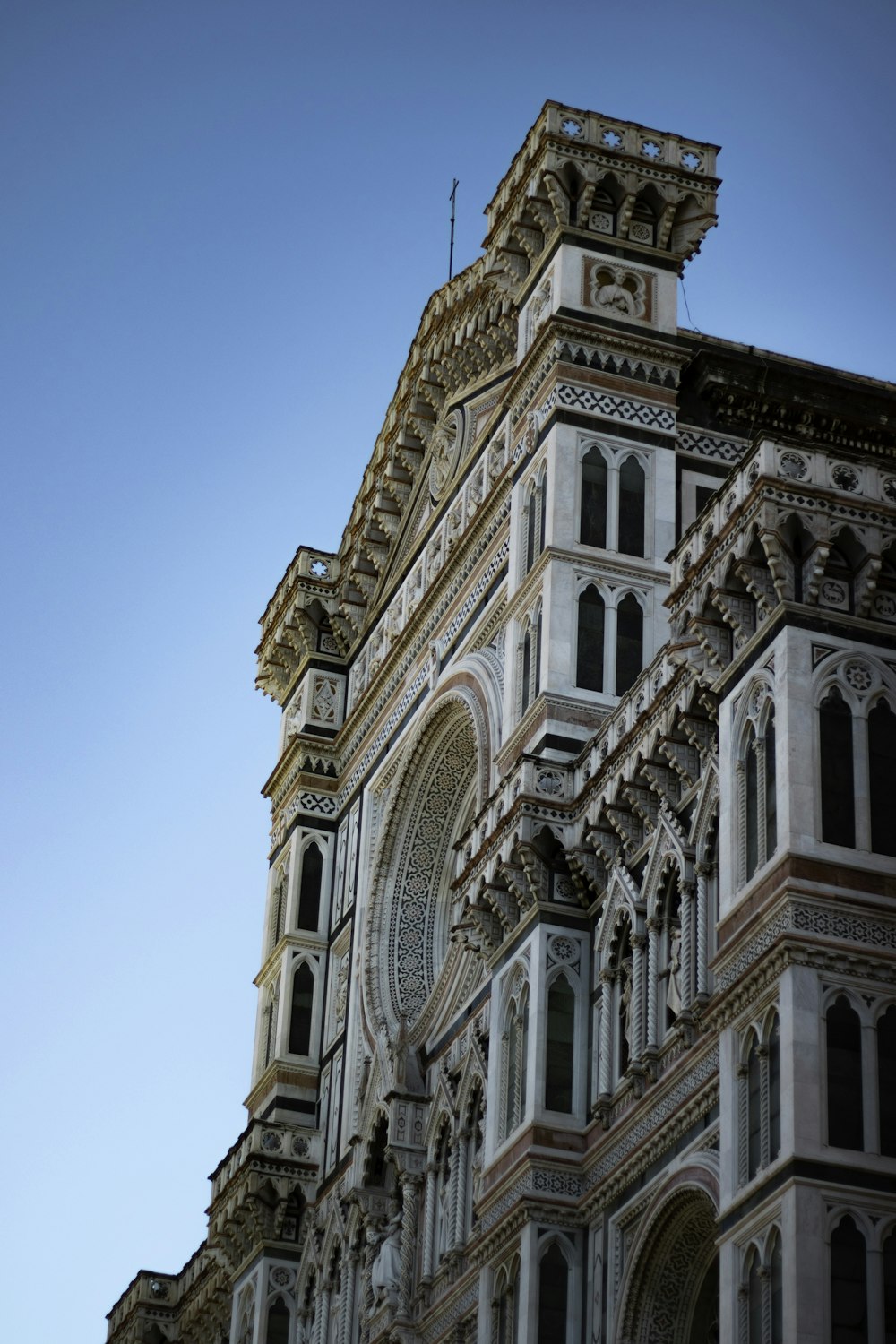 a very tall building with a clock on it's side