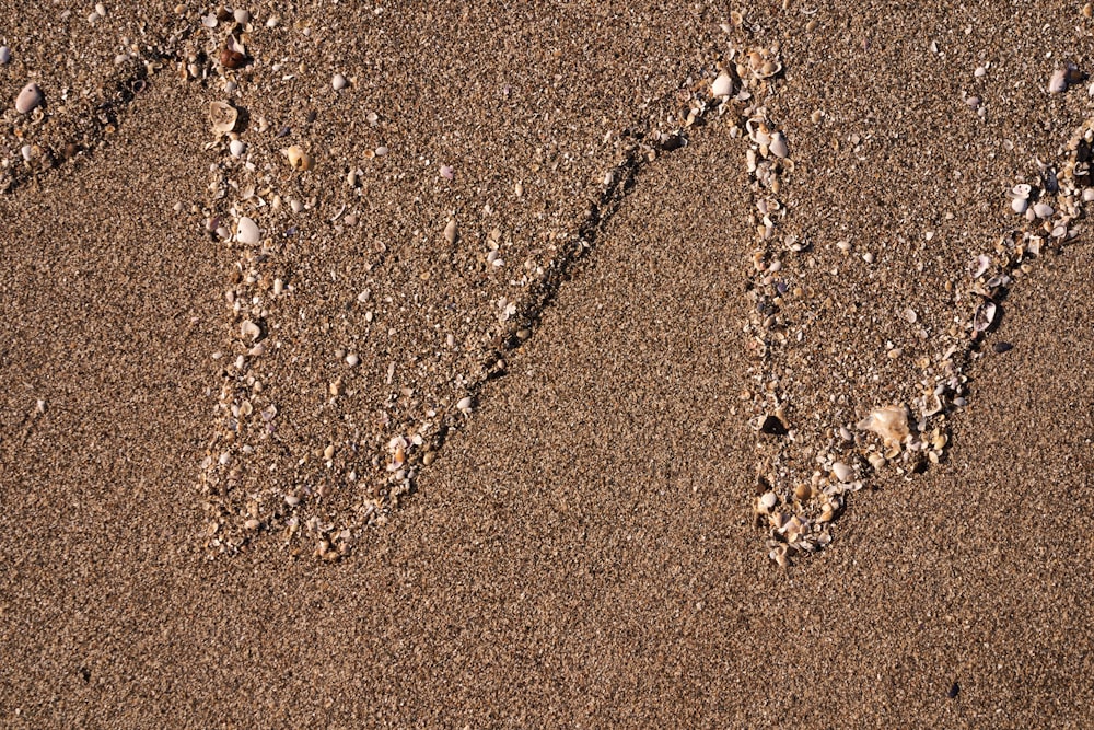 the word w is written in the sand