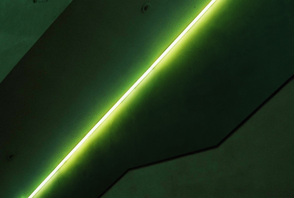 a close up of a wall with a neon light