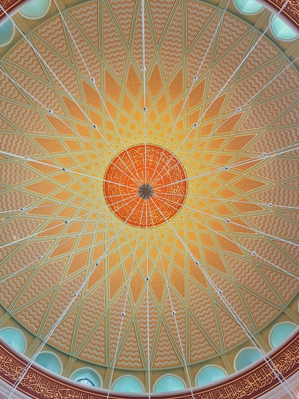the ceiling of a building has a circular design