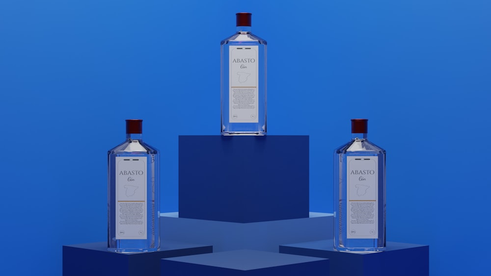 three bottles of vodka sitting on top of each other