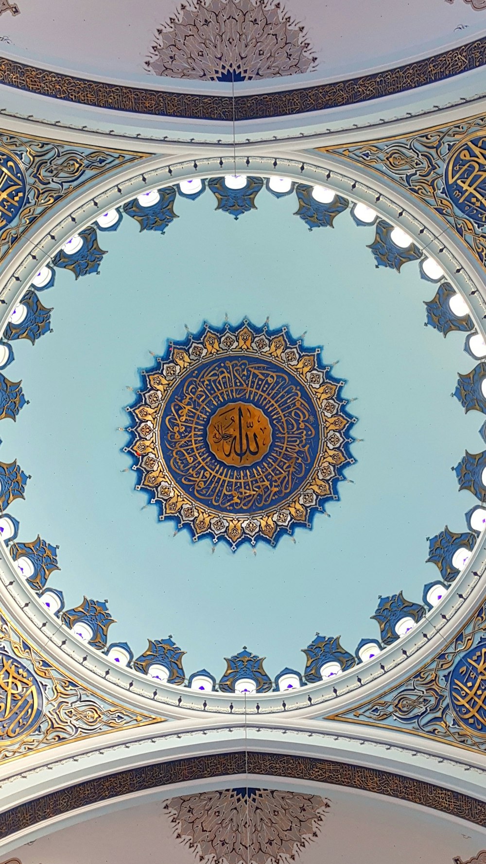 the ceiling of a building with a blue and gold design