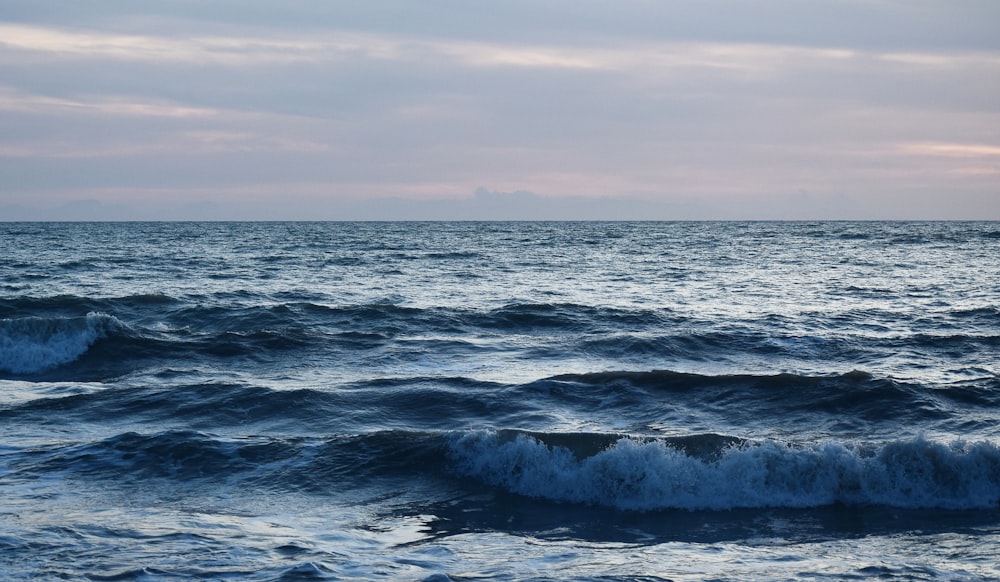 a large body of water with waves coming in to shore