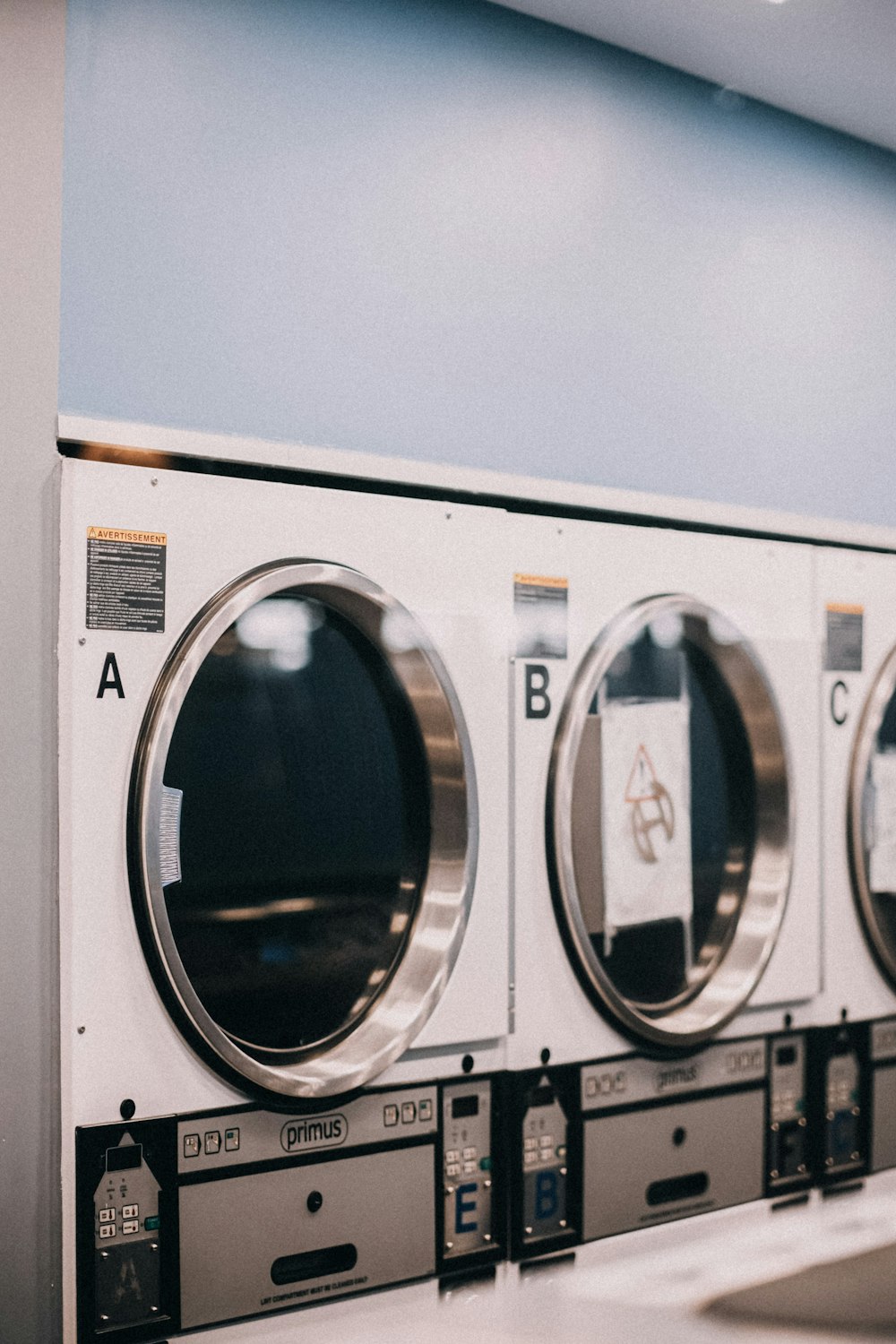 a row of washers sitting next to each other