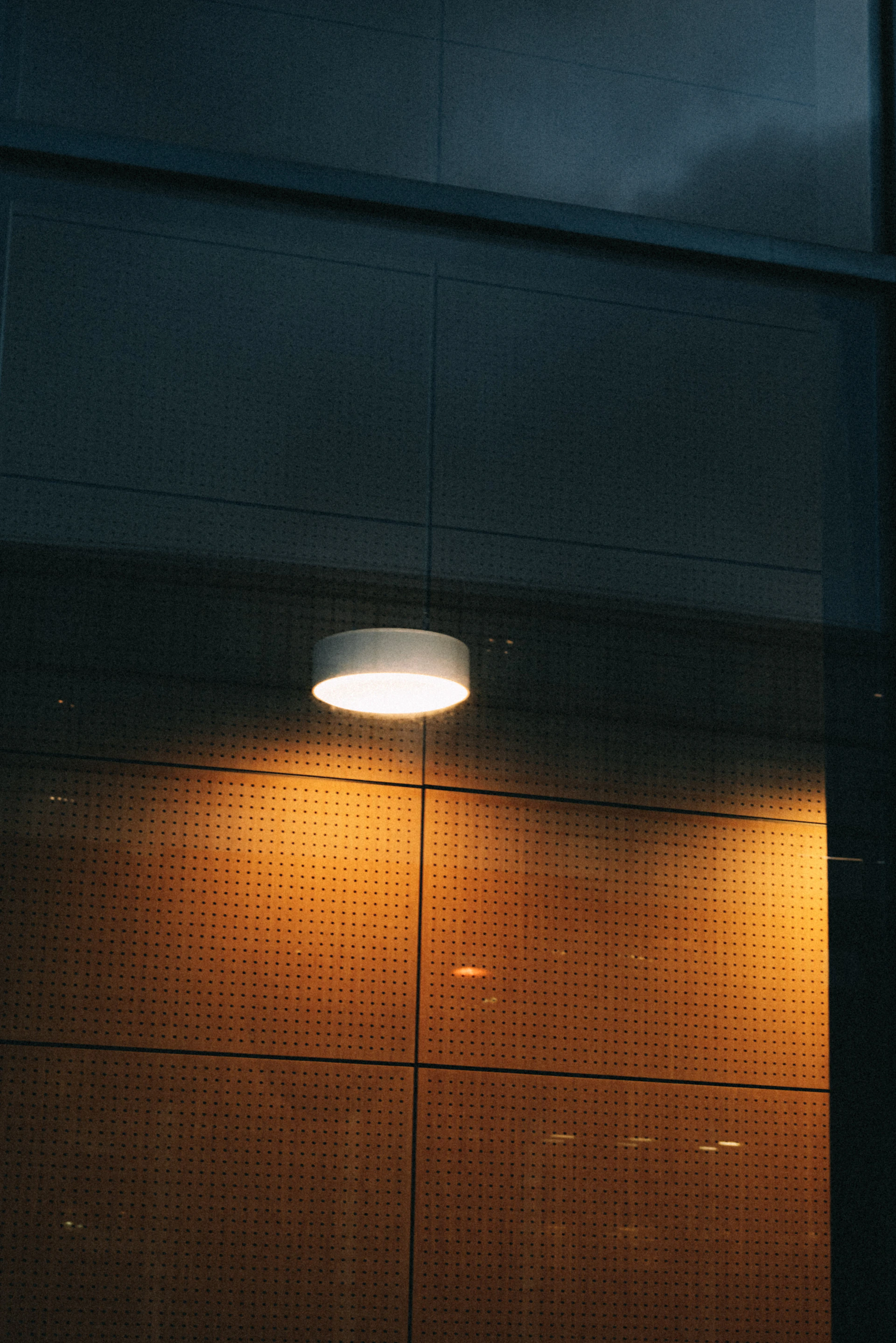 a clock on the side of a building at night