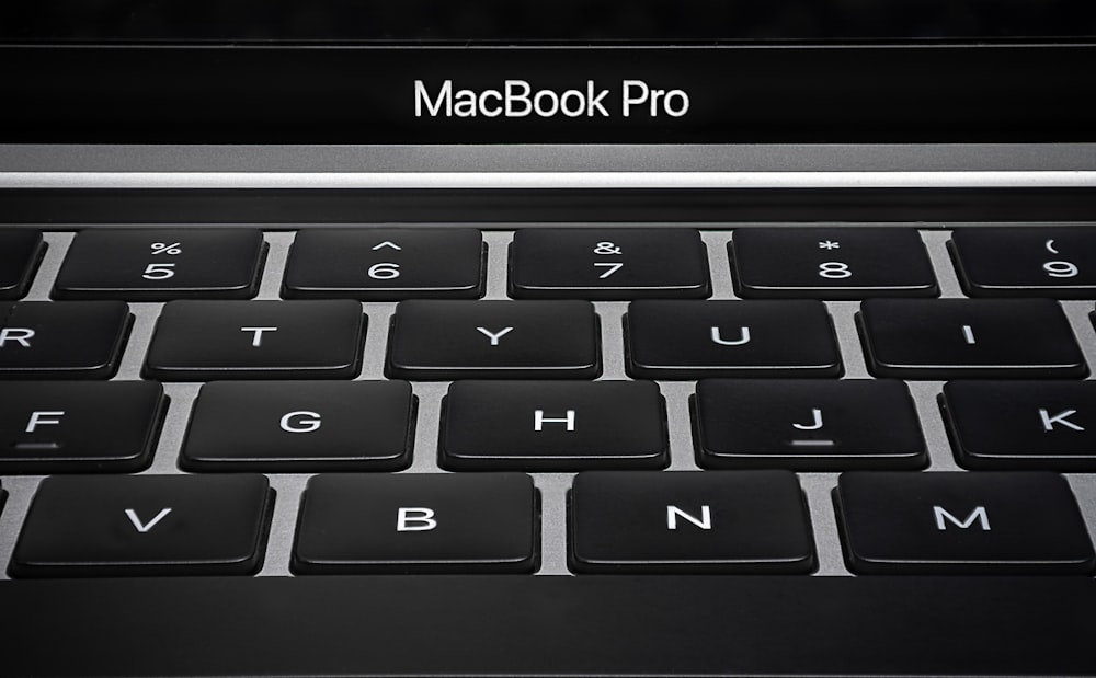 a close up of a macbook pro keyboard