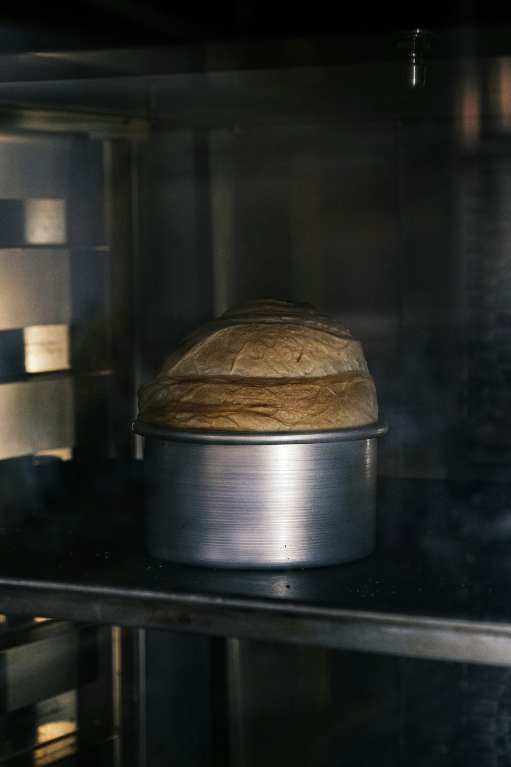 a loaf of bread sitting on top of an oven