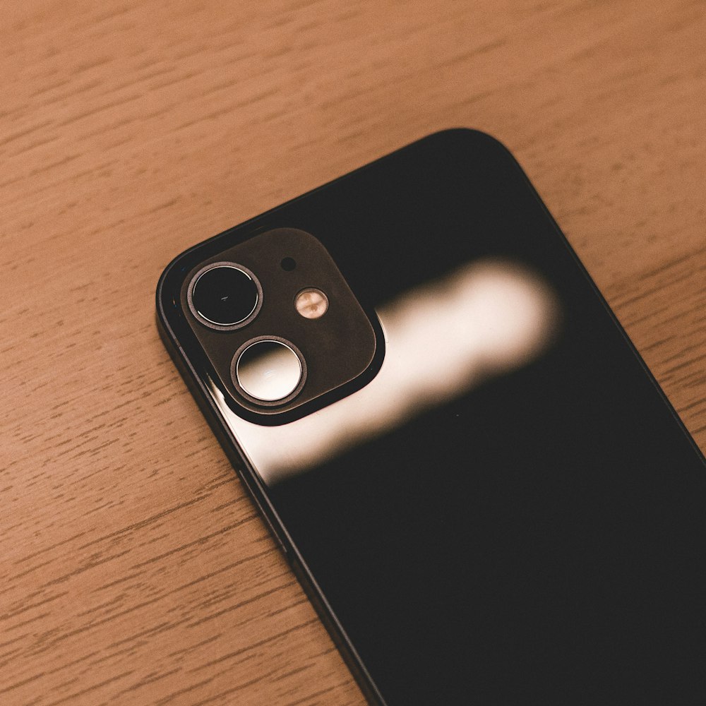 a close up of a cell phone on a table