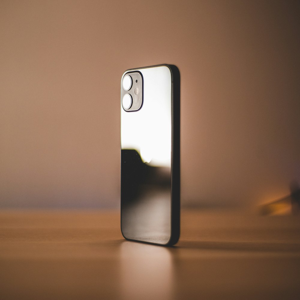 a close up of a cell phone on a table