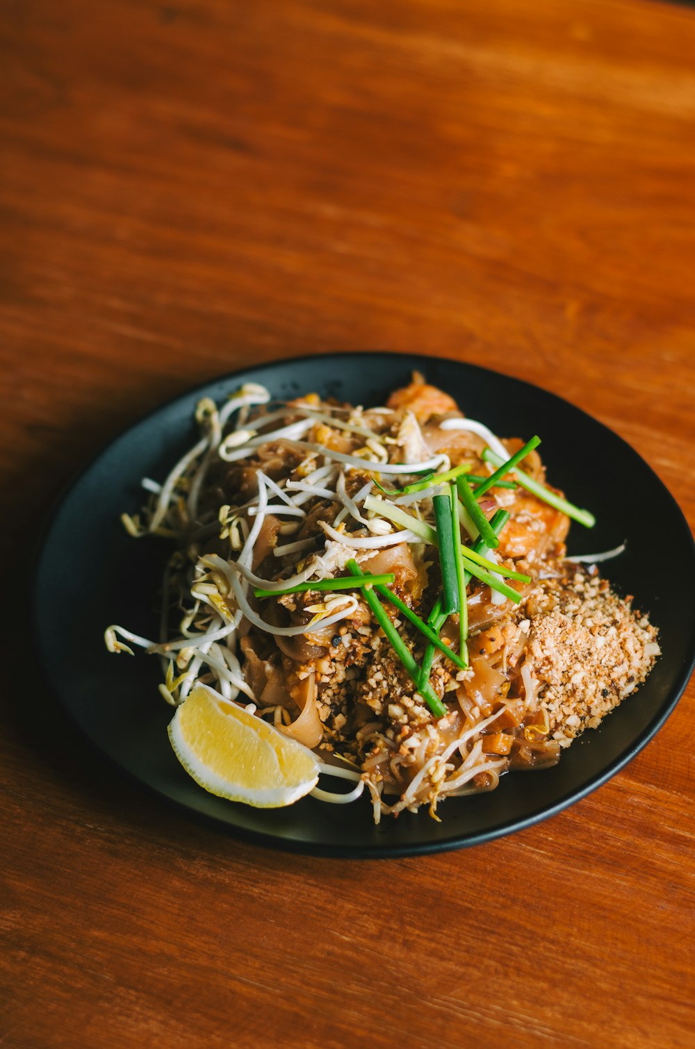 a plate of food on a wooden table