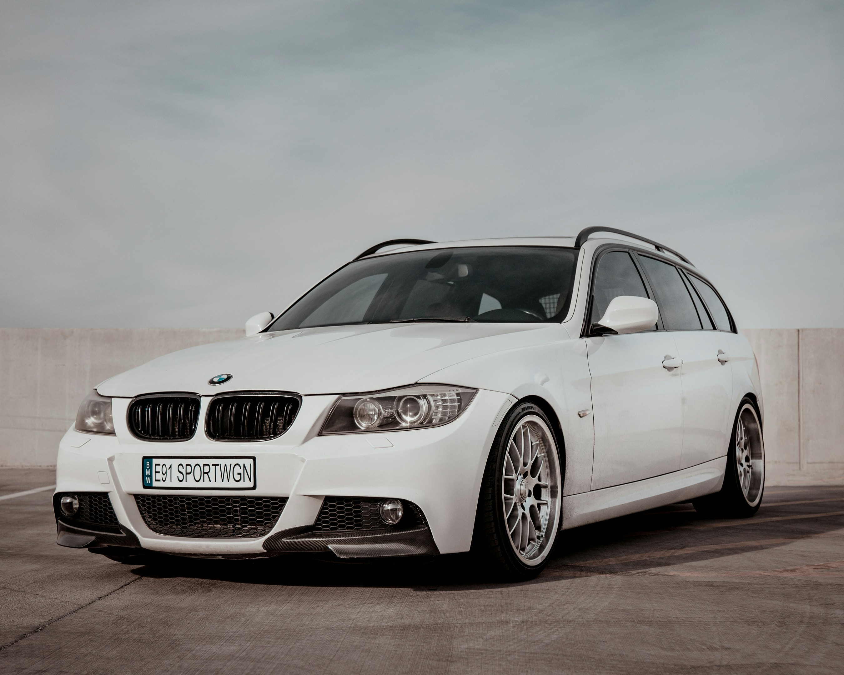 a white car parked in a parking lot