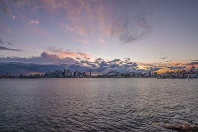 A panoramic view of Durgapur Barrage at sunset with calm waters reflecting the sky.
