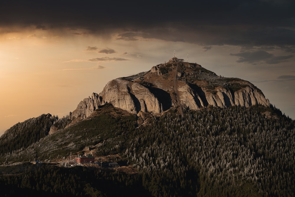 a mountain with a house on top of it