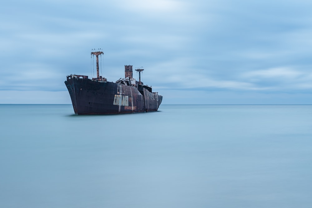 a large ship sitting in the middle of the ocean