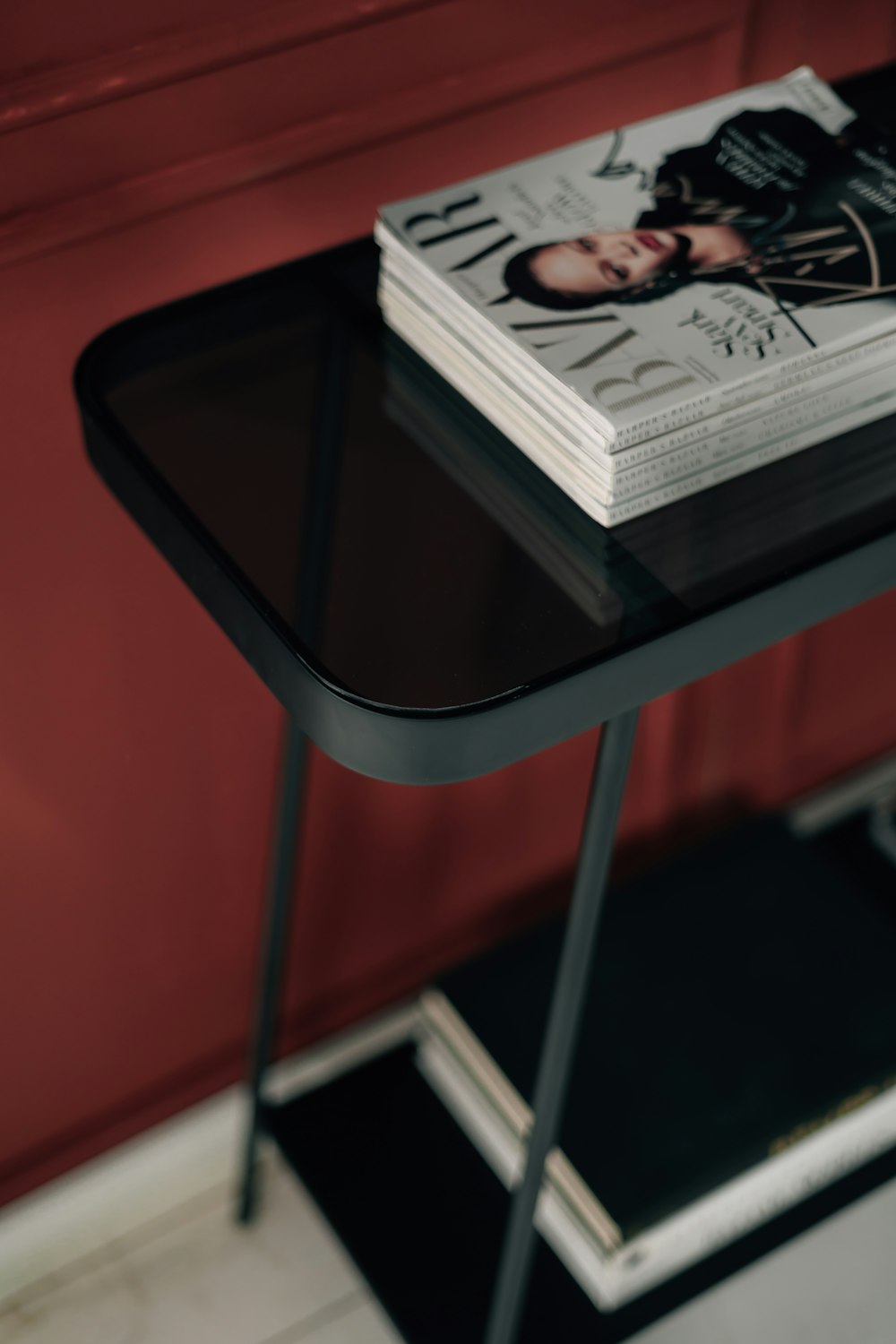 a magazine sitting on top of a black table