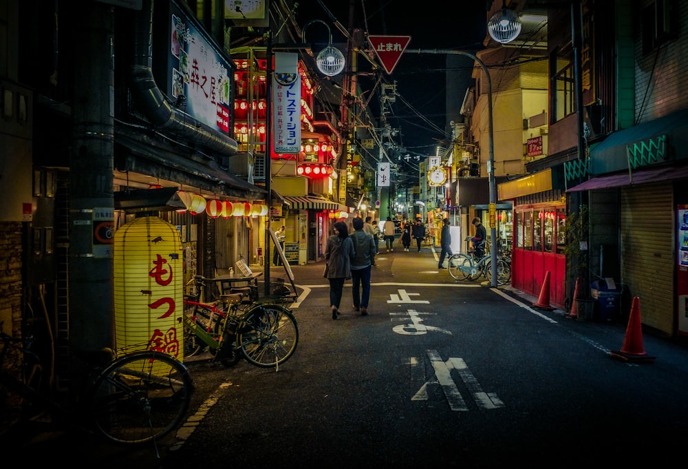 a couple of people that are walking down a street