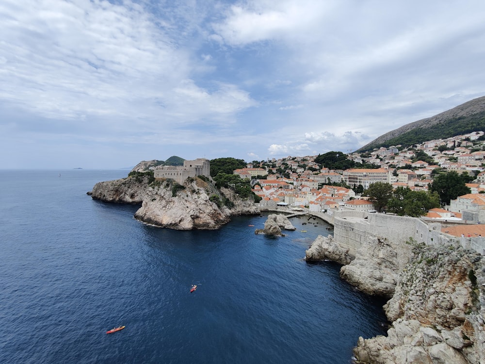 a body of water with a small town in the background