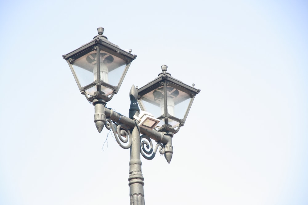 a lamp post with two lights attached to it